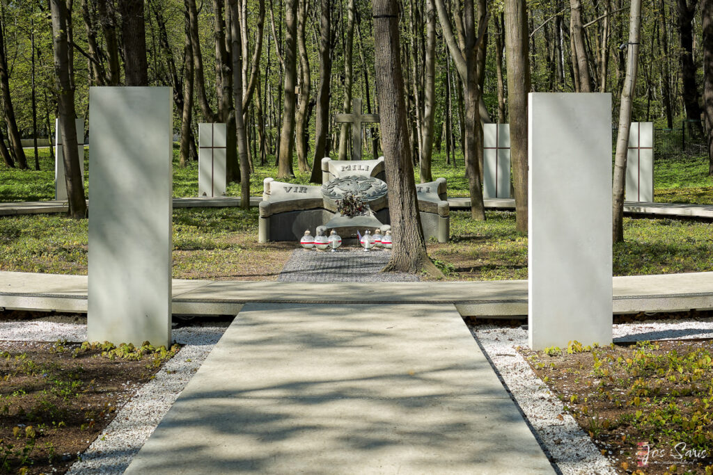 a stone bench in a cemetery