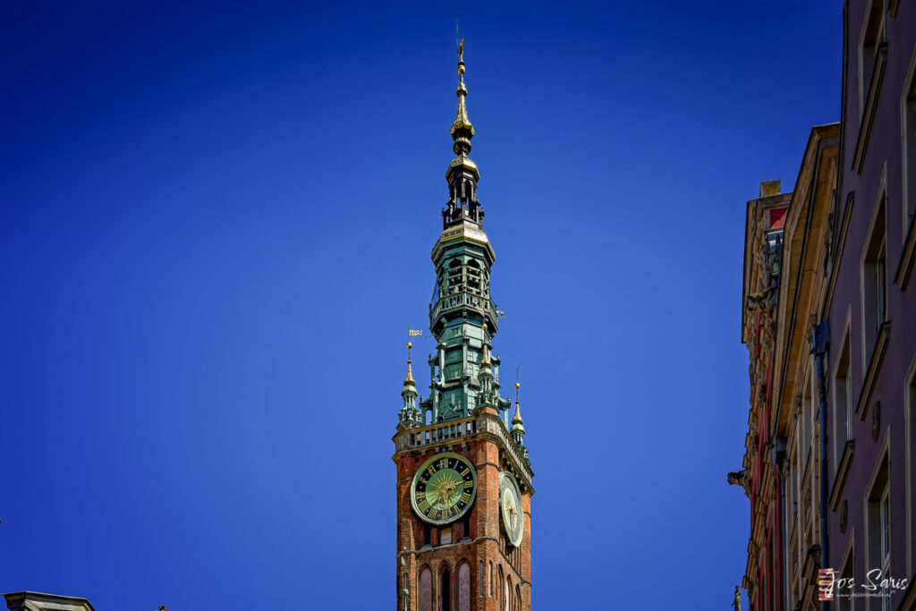 a clock tower with a blue sky