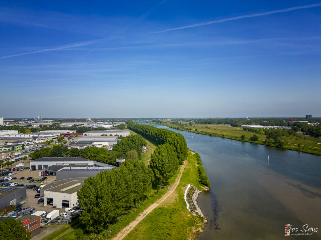 a river with buildings and trees