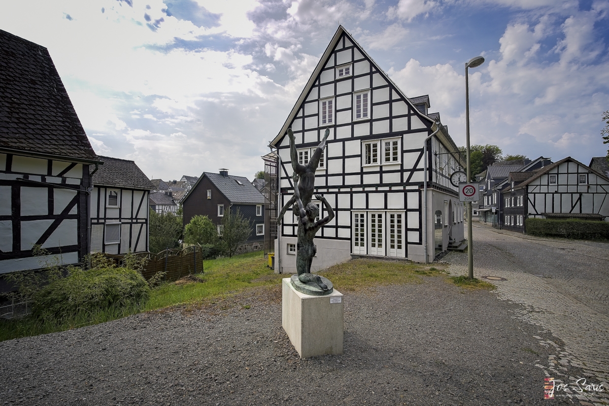 a statue in front of a building