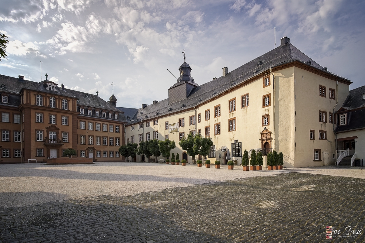 a large building with trees in front of it