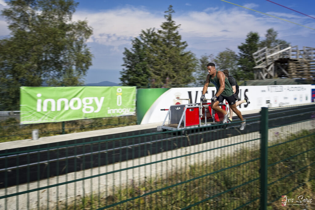 a man riding a bicycle on a metal cart