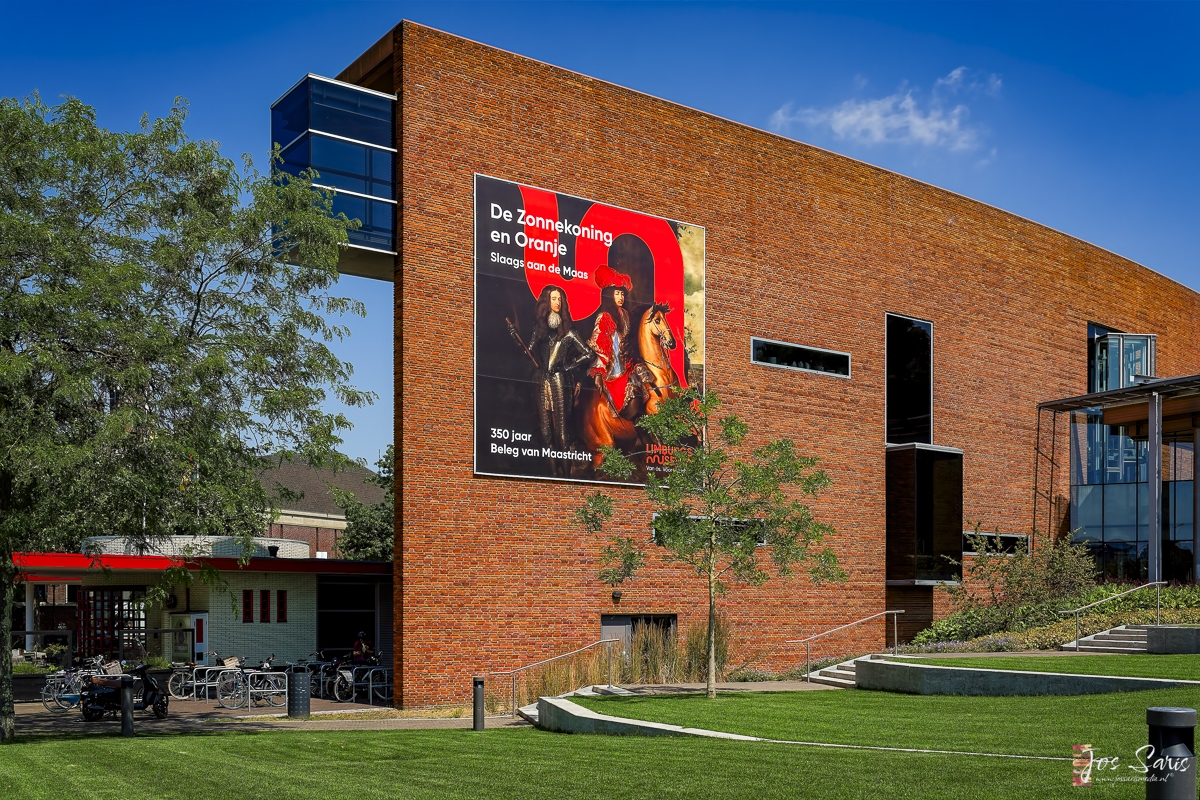 a brick building with a poster on the side