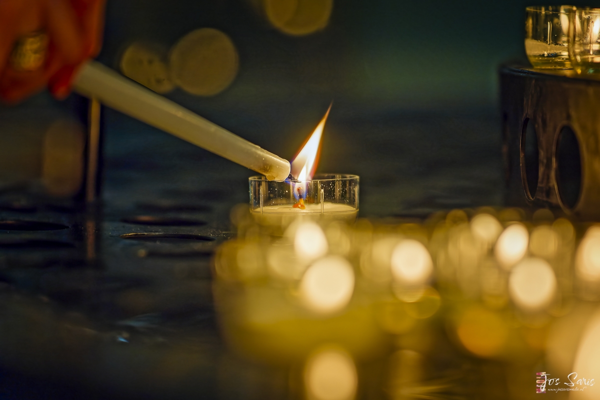 a lighter being lit by a candle