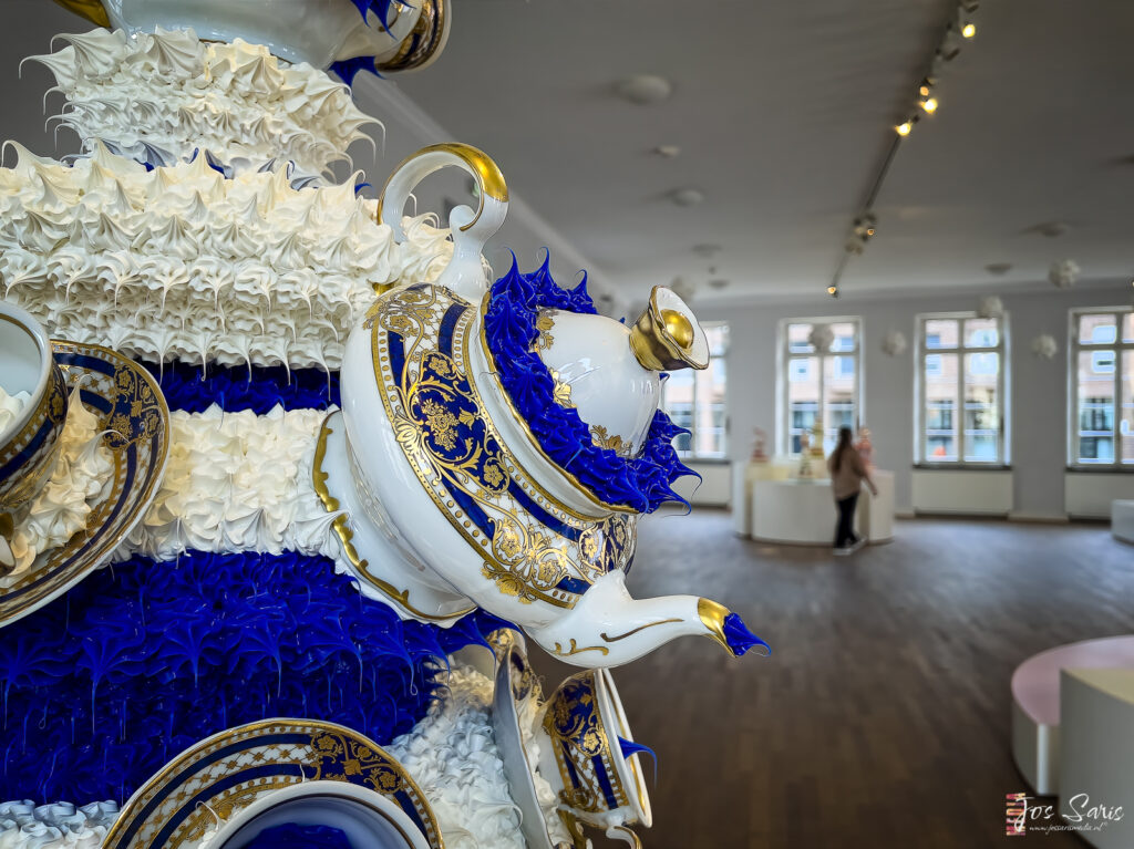 a teapot with blue and white frosting