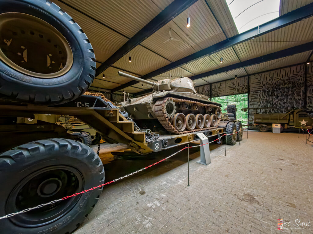a tank on a trailer in a building
