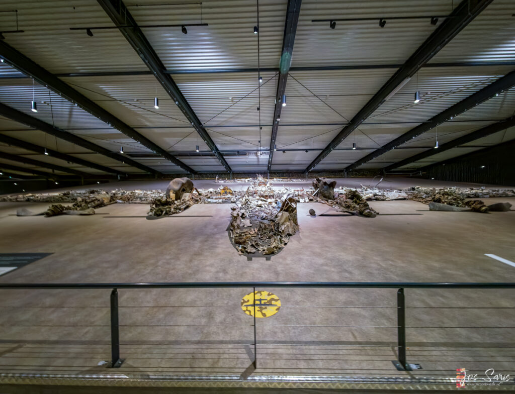 a large room with a metal railing and a metal fence