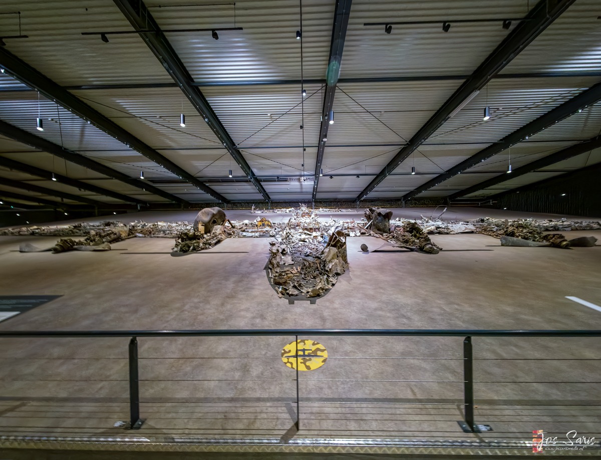 a large room with a metal railing and a metal fence