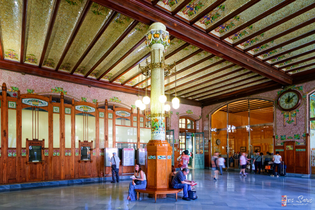 people sitting on a pedestal in a building